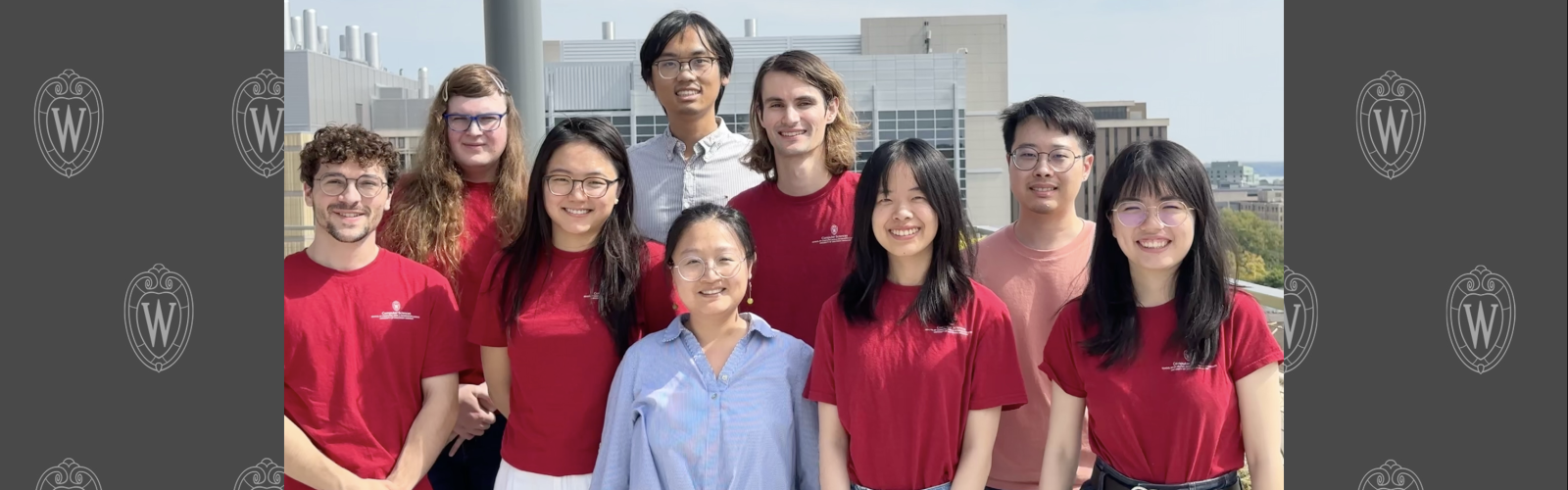 Lab members Fall 2025 smiling at the camera wearing matching red shirts.