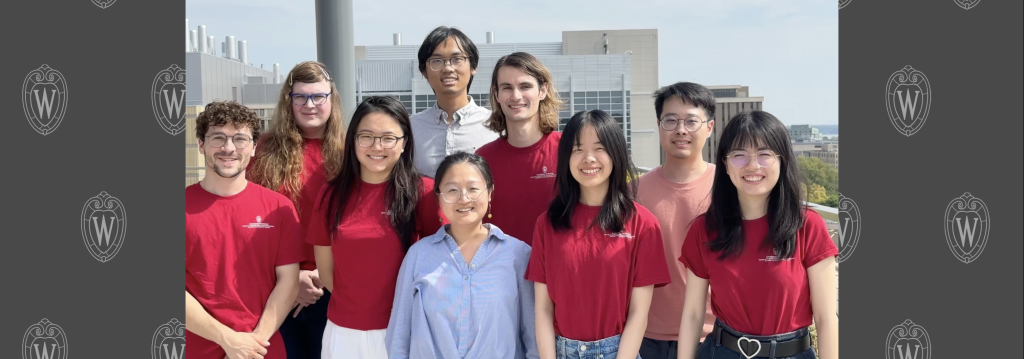 Lab members Fall 2025 smiling at the camera wearing matching red shirts.
